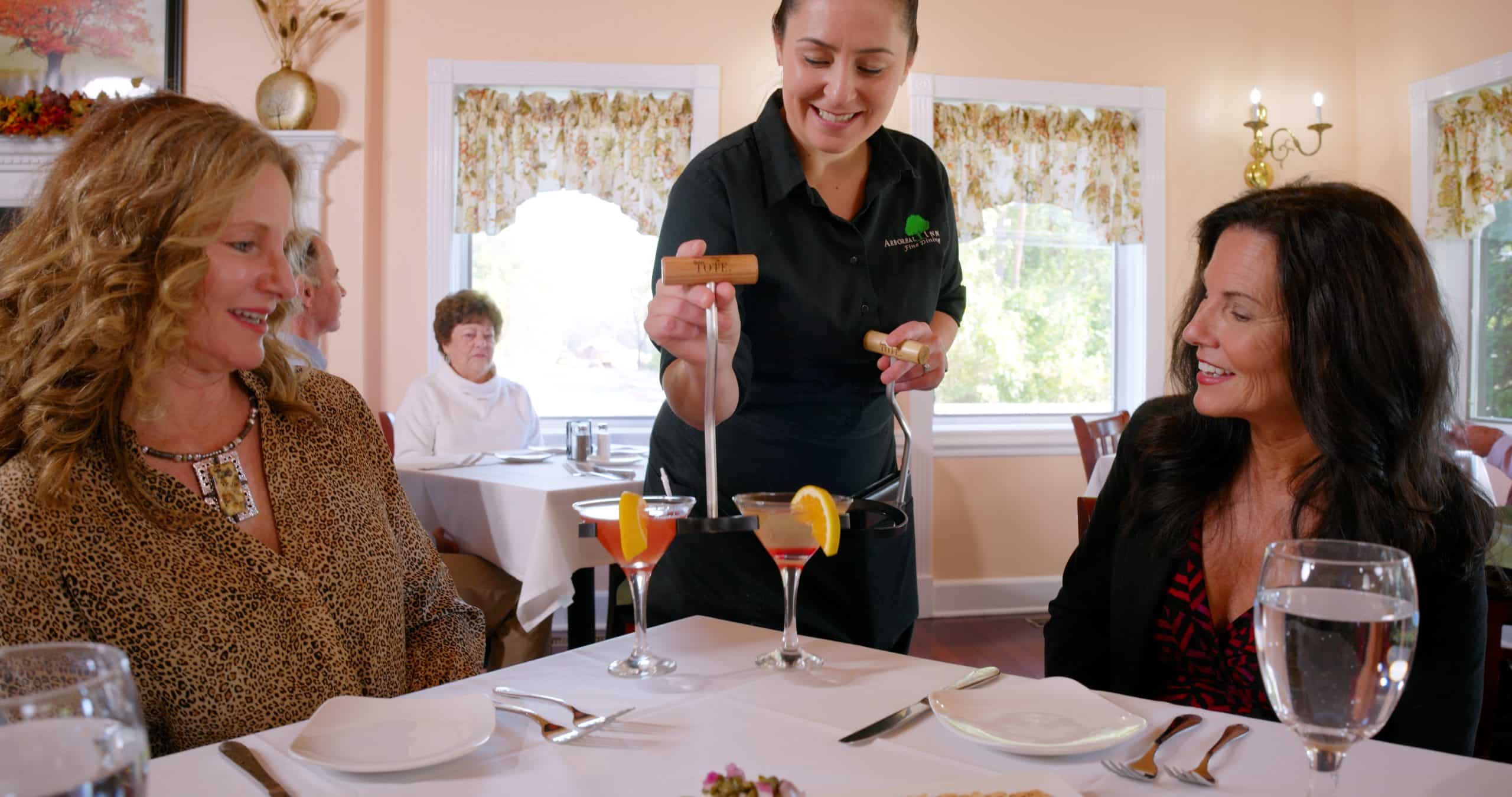 Toddy TOTE double carrier server delivering colorful martinis